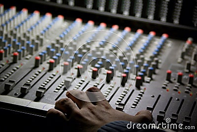 Mixingdesk and human hand Stock Photo