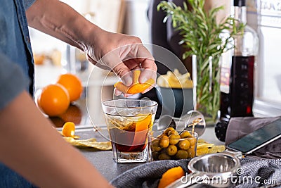 Mixologist making refreshing cocktail with vermouth at home Stock Photo