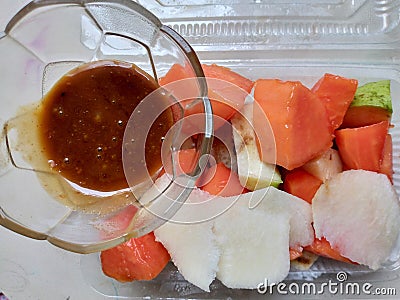 A mixture of various kinds of fruit and peanut sauce is called Rujak Stock Photo