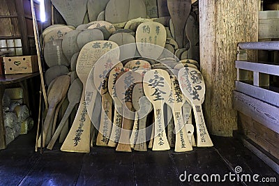 Miyajima, Japan - May 26, 2017: Giant wooden rice spoons,shamoji, in the Toyokuni Shrine, hall of One Thousand Tatami Mats Editorial Stock Photo