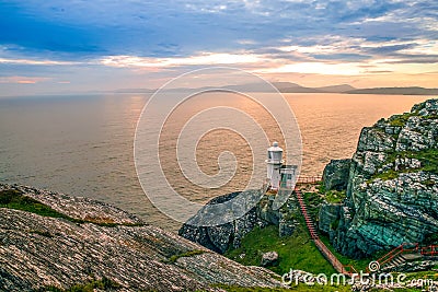 Mizen Head Sheep`s Head Peninsula West Cork Ireland lighthouse cliffs rocks landmark sunset wild Atlantic Stock Photo