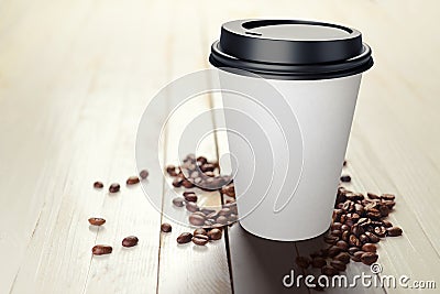 330 ml disposable coffee paper cup with beans on white wooden table Stock Photo