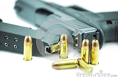 9mm bullets and black gun pistol isolated on white background. Stock Photo