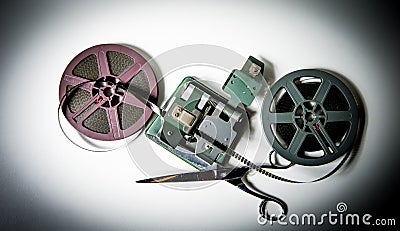 8mm movie reels, film on splicer ans scissors Stock Photo