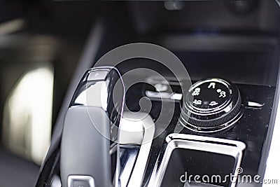 MMOSCOW, RUSSIA - MARCH 15, 2020: Close-up of the suspension control lever on the center panel in the interior of the Blue SUV Editorial Stock Photo