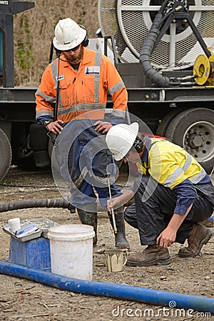 Plugging the well Editorial Stock Photo