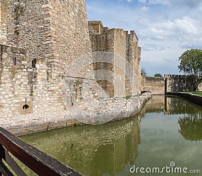 The moat filled with water in the ruins of the Smederevo fortress, standing on the banks of the Danube River in Smederevo town in Stock Photo