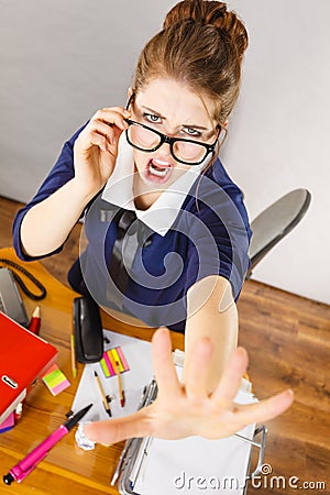 Angry mad bossy businesswoman being furious Stock Photo