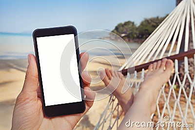 Mobile application for travels, phone in hand, beach Stock Photo