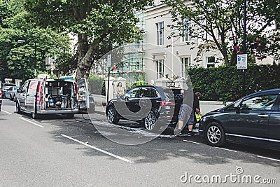 Mobile car washing service on London street Editorial Stock Photo