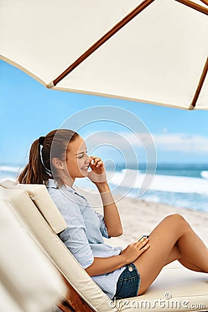 Mobile Communication. Woman Calling On Phone. Summer Beach. Freelance Stock Photo