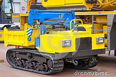Mobile construction crane yellow blue color with telescopic loading platform Stock Photo