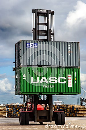 Mobile container handler in action at a container terminal in the Port of Rotterdam. September 6, 2015 Editorial Stock Photo