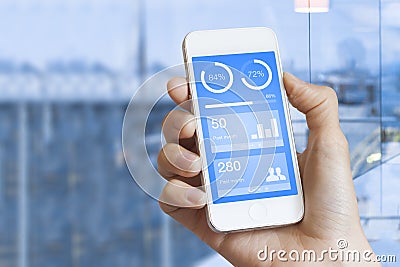 Mobile dashboard on smartphone screen displaying statistics with charts Stock Photo