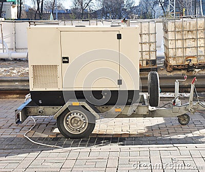 Mobile Diesel Backup Generator with Fuel Tanks Outdoor. Stock Photo