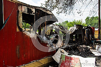 Mobile home destroyed by fire. Stock Photo