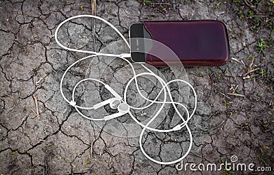 Mobile Music Player on Cracked Earth Stock Photo