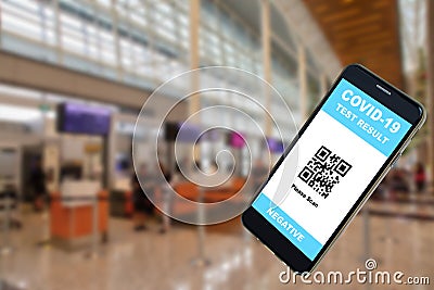 Mobile Phone App Showing Covid-19 Test Result at Airport Departure Stock Photo