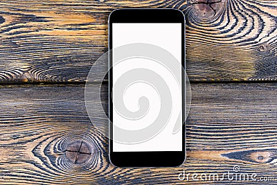 Mobile phone with blank screen mock up isolated on wood table background. Smartphone on wood table. Smartfone white Stock Photo