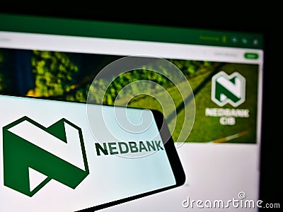 Mobile phone with business logo of South African bank Nedbank Group Limited on screen in front of website. Editorial Stock Photo