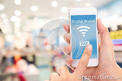 Mobile phone with digital wallet concept, Blur department store Stock Photo