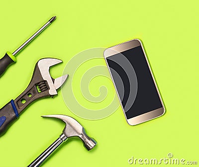 Mobile phone fixing concept for cellphone repairing company`s advertisement in social media, print or website. Stock Photo