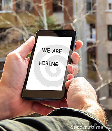 Mobile phone, We are hiring caption Stock Photo