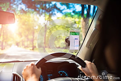 Mobile phone with map gps navigation in car. u Stock Photo