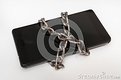 Mobile phone with metal chain locked on white Stock Photo