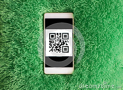 Mobile phone with qr-code on the screen. Artificial soft nap background Stock Photo