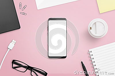 Mobile phone with screen on pink, female desk Stock Photo