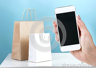 Mobile phone and shopping bags on line purchase concept.Internet shop Stock Photo