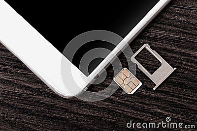 Mobile phone and sim card Stock Photo