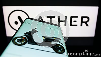 Mobile phone with webpage of Indian scooter company Ather Energy Pvt. Ltd. on screen with logo. Editorial Stock Photo