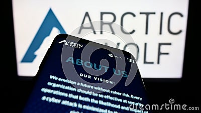 Mobile phone with website of cybersecurity company Arctic Wolf Networks Inc. on screen in front of logo. Editorial Stock Photo