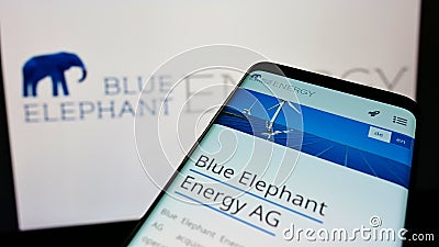 Mobile phone with website of German solar energy company Blue Elephant Energy AG on screen in front of logo. Editorial Stock Photo