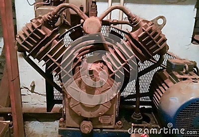 Mobile photo. Old industrial piston compressor for the air supply. Stock Photo