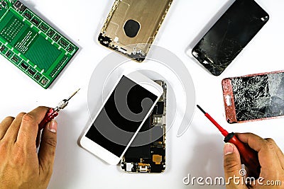 Mobile phone Repair Technician Prepare cell phone repair for his customers. Stock Photo