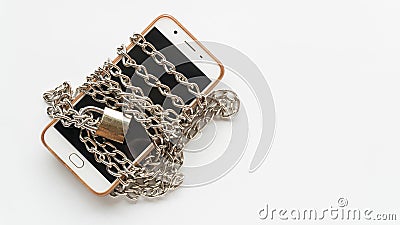 Mobile smart phone lock by steel chain Stock Photo