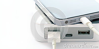 Mobile smart phone smartphone charging with power bank on white background Stock Photo