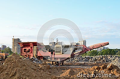 Mobile Stone Jaw crusher machine for crushing concrete into gravel and subsequent cement production. Salvaging and recycling of Stock Photo