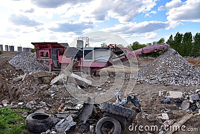 Mobile Stone Jaw crusher machine for crushing concrete into gravel and subsequent cement production. Salvaging and recycling of Stock Photo