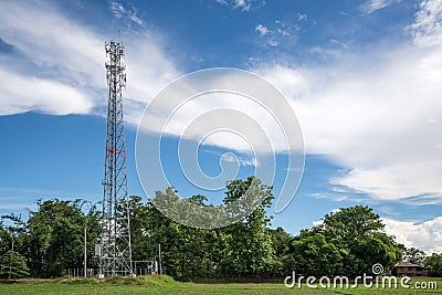 Mobile towers on blue sky,white cloud and tree background. Stock Photo