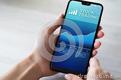 Mobile trading application with stock market chart on smartphone screen. Forex, investment business technology concept Stock Photo