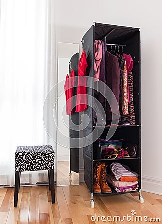 Mobile wardrobe with clothing and shoes Stock Photo