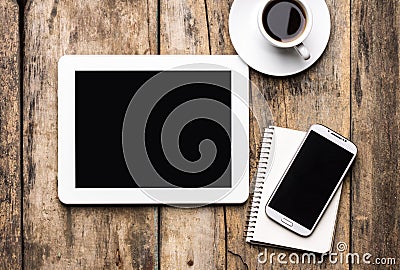 Mobile workplace with tablet PC, phone and cup of coffee Stock Photo