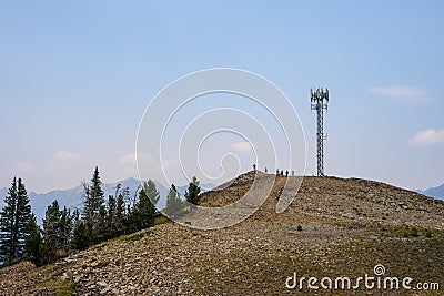 Mobility cell site on a shale covered mountain top, self-supporting tower with panel antennas Stock Photo