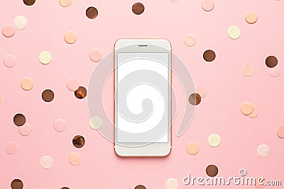 Moble phone with pink,gold and yellow confetti on pink color paper background minimal style Stock Photo