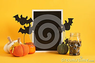 mocap black sign and halloween decor on a bright yellow background Stock Photo