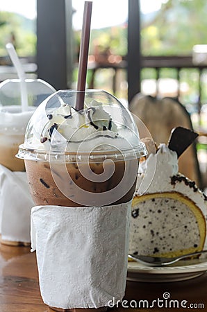 Mocha ice coffee in glassware and cake Stock Photo